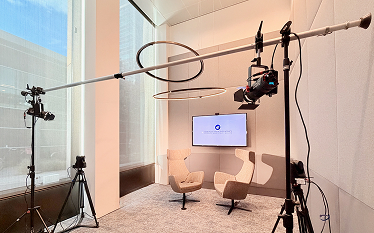 Podcast recording room in the EMA building with cameras, microphones, lighting equipment, and seating set up for a recording