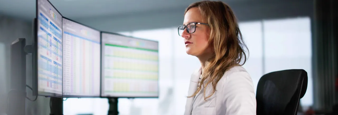 Woman looking at screens