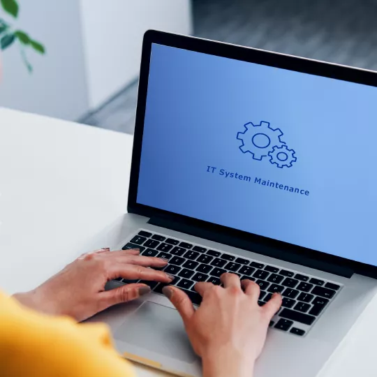 woman typing at laptop