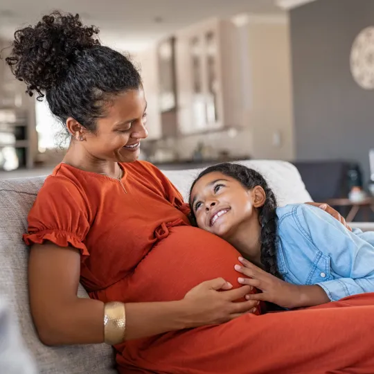 Pregnant woman with child