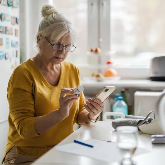 woman holding medicine bottle